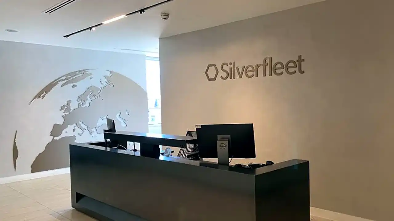 silverfleet capital reception area decked with brown wall and a world map